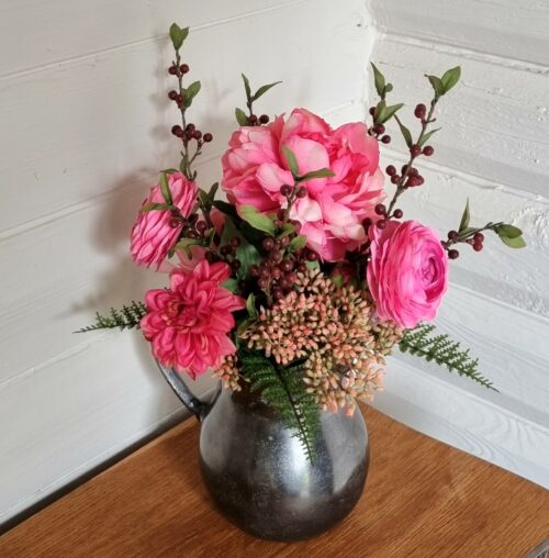 Smukke blomster i den massive kande