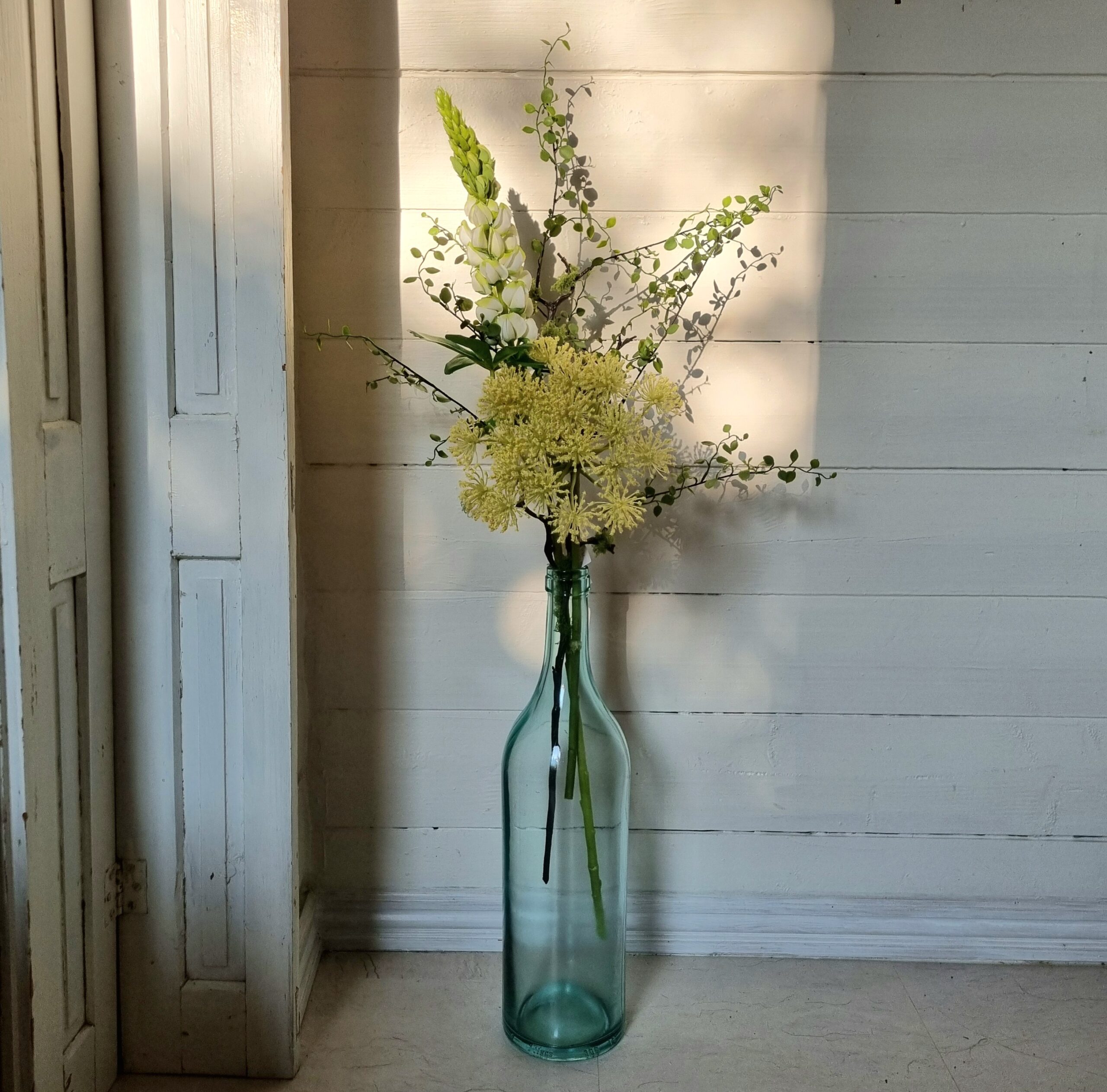 Stor smuk lys grøn flaske